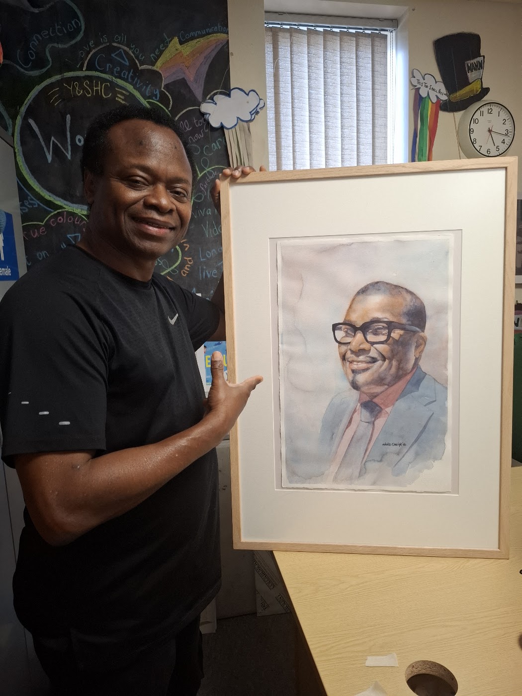 Nduka Omeife with his Black History Month portrait, York Hospital exhibition 2026, photograph 2