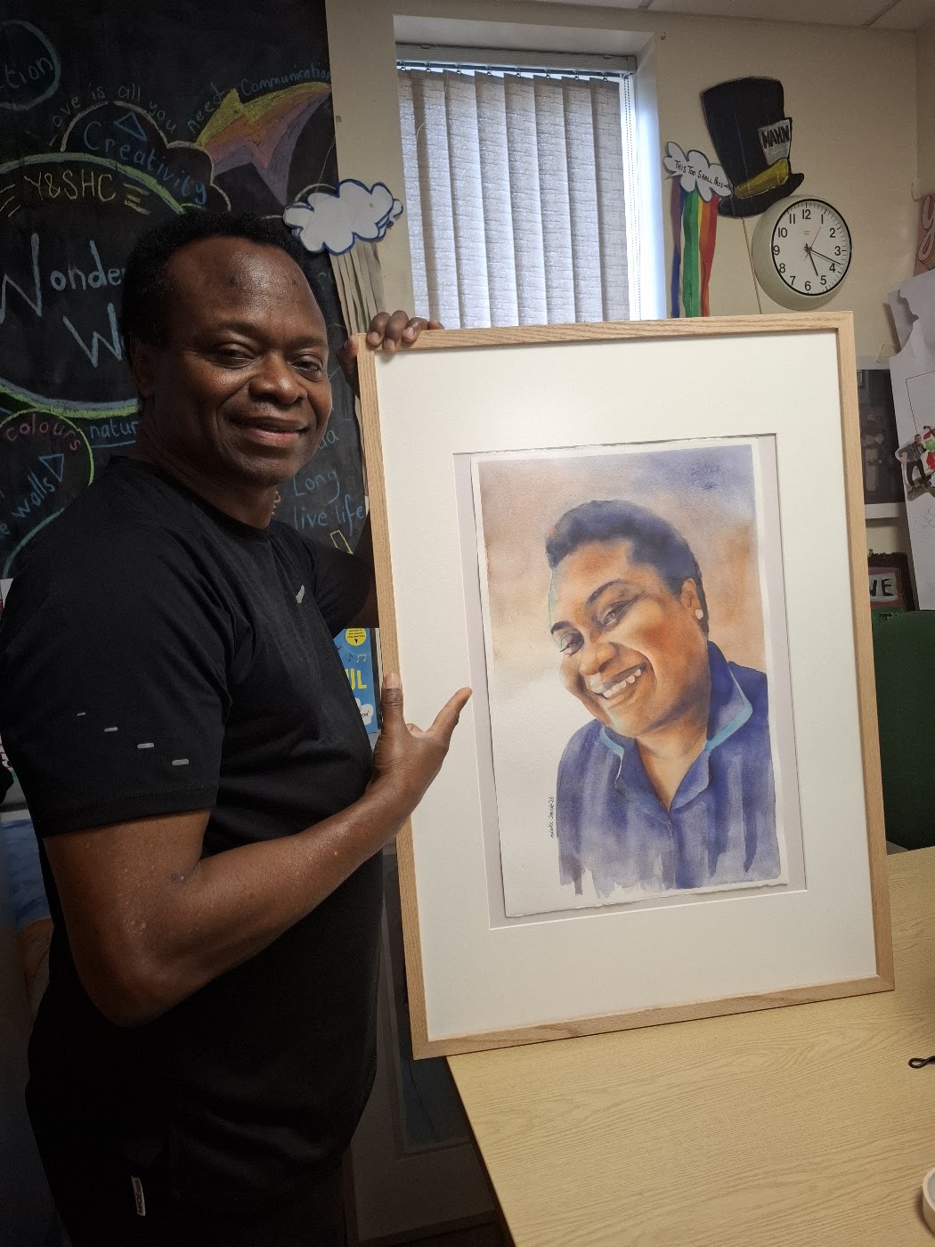 Nduka Omeife with his Black History Month portrait, York Hospital exhibition 2026, photograph 5