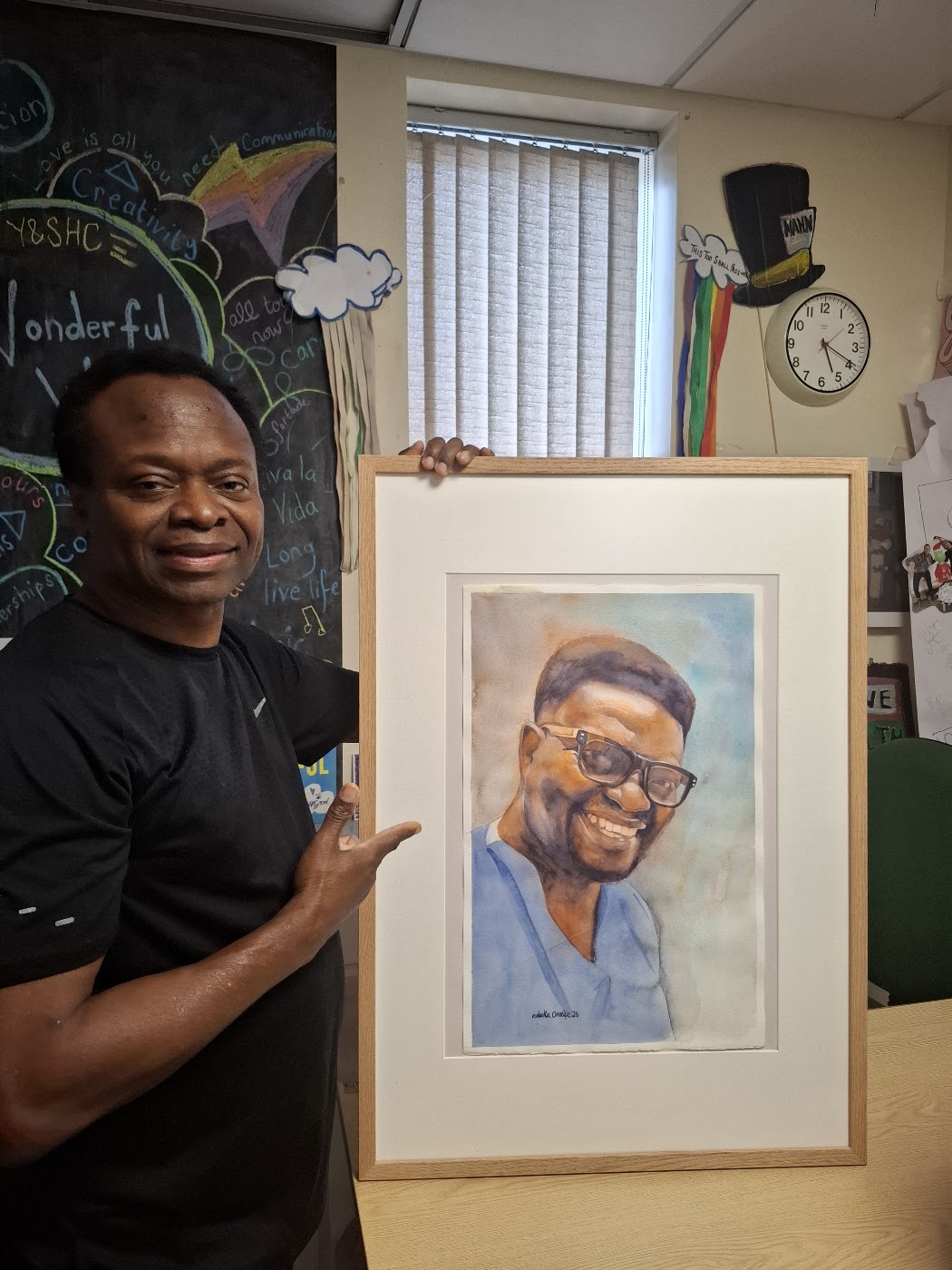 Nduka Omeife with his Black History Month portrait, York Hospital exhibition 2026, photograph 7
