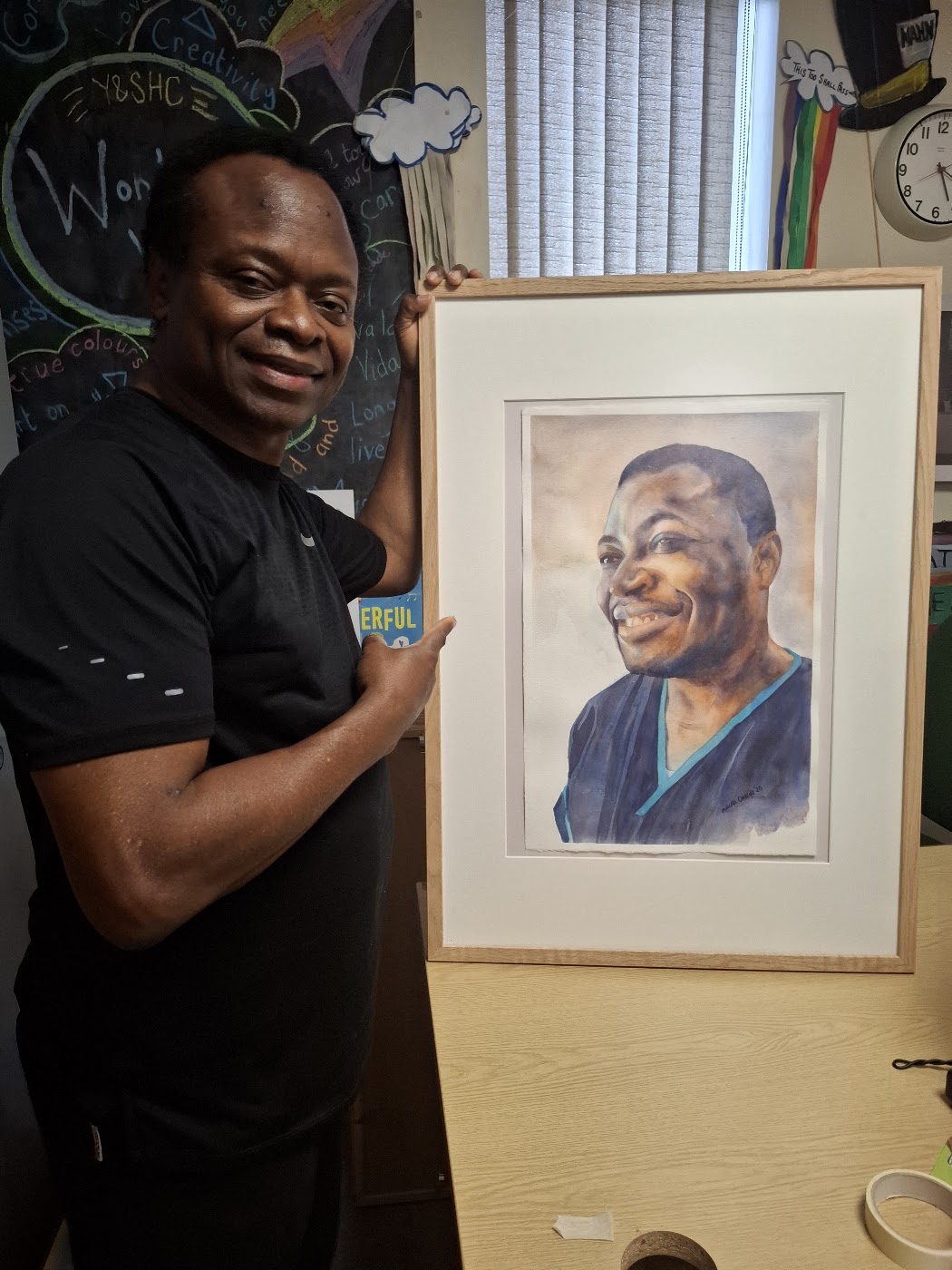 Nduka Omeife with his Black History Month portrait, York Hospital exhibition 2026, photograph 8